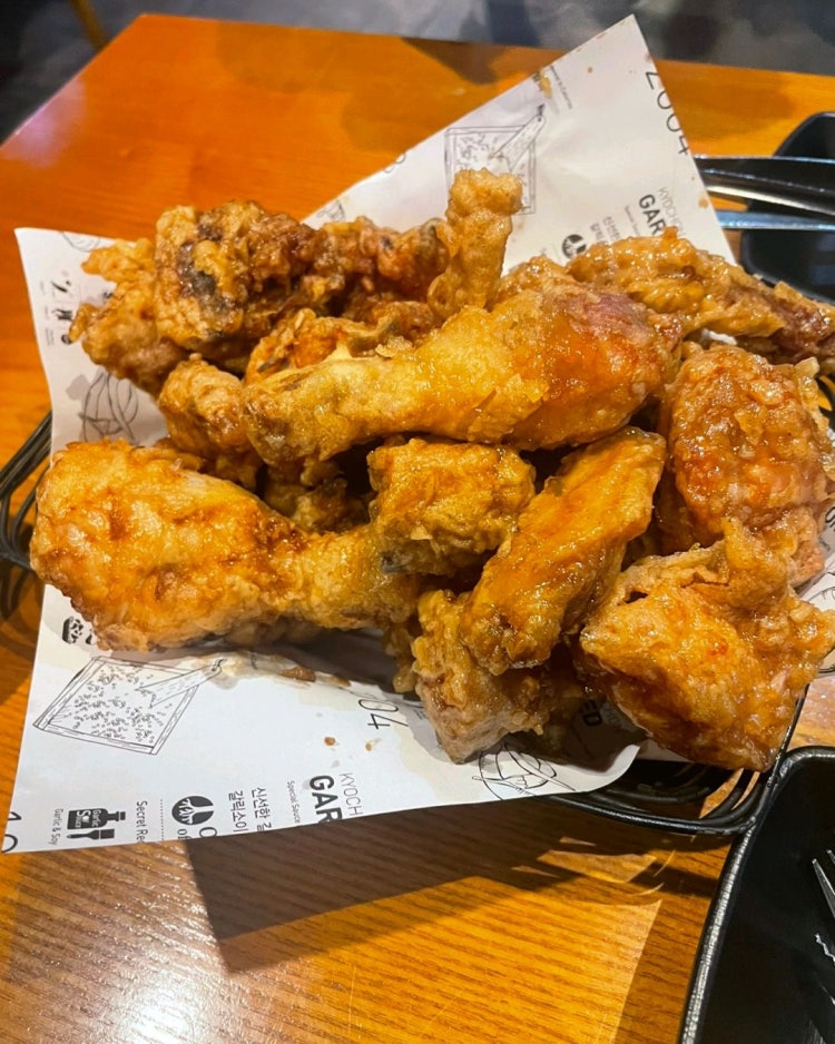 Crispy Korean fried chicken with signature sauce at Kyochon Apgujeong
