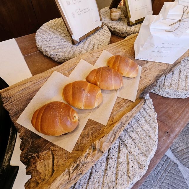 Buttery salt bread rolls dusted with flaky sea salt at Jayeondo Salt Bread Dosan
